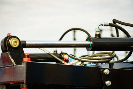 Hydraulic mechanism on modern machine. Industrial detail piston in machinery. Technology.の写真素材