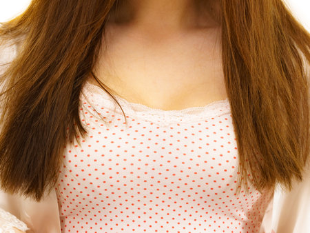 Woman in underwear dotted shirt showing her necklineの写真素材