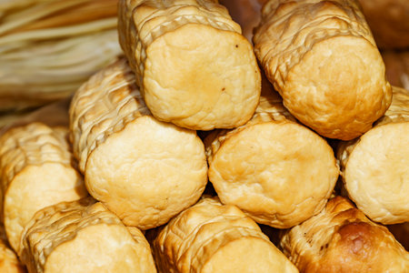 Traditional polish cheese pieces oscypek on market stall outdoor.