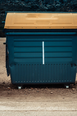 Industrial big garbage bin outdoors on roadsideの写真素材