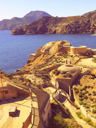 Mediterranean Sea coast landscape with ruins on seashore, spanish coastline near Cartagena, in Murcia region.の写真素材