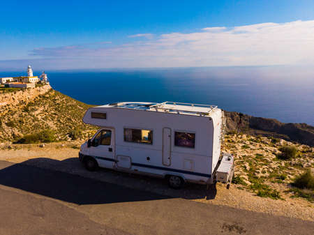 Camper vehicle at Mesa Roldan lighthouse, Cabo de Gata Nijar Natural Park in Almeria province, Andalusia Spain. Tourist attraction, place to visit.の写真素材