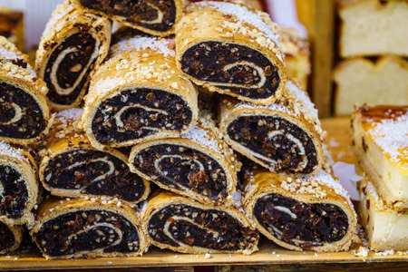Fresh strudel poppy seed rolls. Delicious cakes at food market.の写真素材