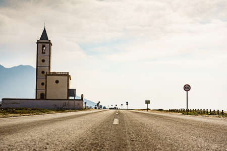 Coast road and church of San Miguel in Almadraba de Monteleva, Cabo de Gata Nijar Natural Park, Andalusia Spain.の写真素材
