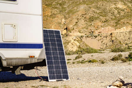 Portable solar photovoltaic panel, charging battery at camper car rv.