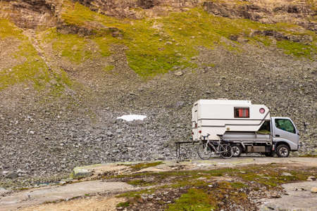 Camper car in norwegian mountains. Travel, holidays and adventure concept.の写真素材