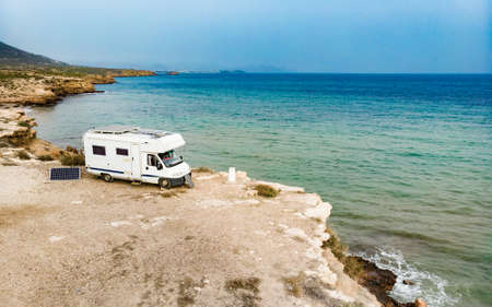Caravan camping on cliff sea shore. Mediterranean region of Mazarron, Sierra de las Moreras in Murcia Spain.の写真素材