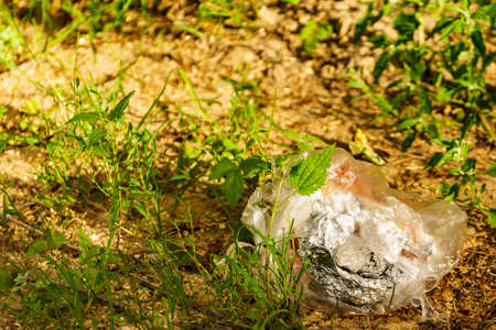 Trash garbage in bag outdoors. Nature environment problems.