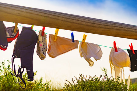 Camping on beach, adventure concept. Clothes clean washing laundry hanging to dry on clothesline...