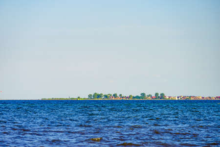 Seascape. Baltic Sea, Puck Bay with Rewa village on horizin, Poland. Nature landscape.の写真素材