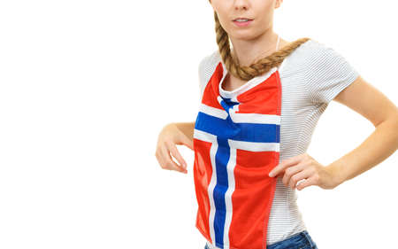 Blonde student woman holding on her chest norwegian flag. Education, language learning.