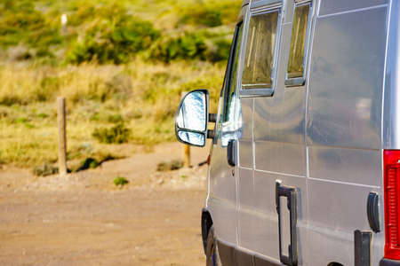 Campervan rv van on mediterranean coast in Spain. Wild camping on nature. Holidays and traveling in...