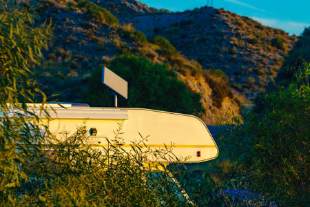 Camper vehicle camping on nature. Adventure, tour with motorhome.の写真素材