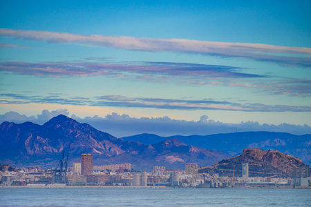 Coastal landscape with view from distance of Alacant city and Castle of Santa Barbara on Mount Benacantil. Spain, Costa Blanca.の写真素材