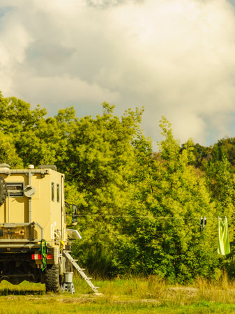Lorry camper, house truck camping on nature. Travel with motorhome.の写真素材