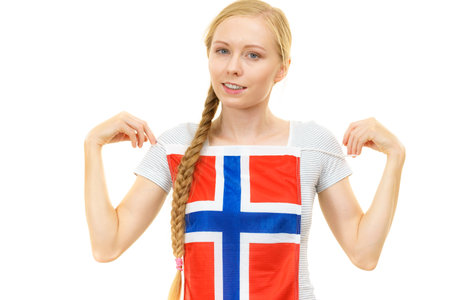 Blonde student woman holding on her chest Norwegian flag. Education, language learning.の写真素材