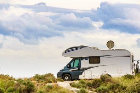 Camper vehicle camping on nature. Adventure, tour with motorhome.の写真素材