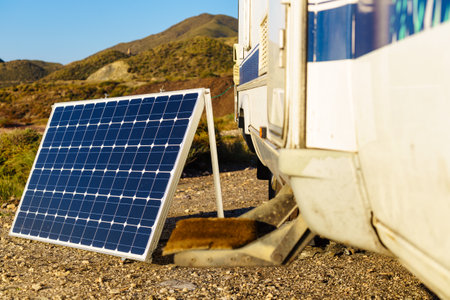 Portable solar photovoltaic panel, charging battery at camper vehicle.の写真素材