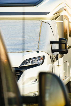 Camper with external thermal screen blind at window pane, front windscreen of the car. Camping on nature. Holidays and travel in motor home.の写真素材