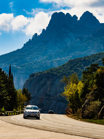 Asphalt road in Mountain of Montserrat, rocky landscape, Catalonia Spain.の写真素材