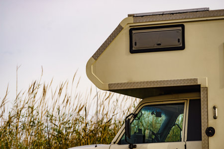 Camper vehicle camping on roadside. Traveling in motor home.の写真素材