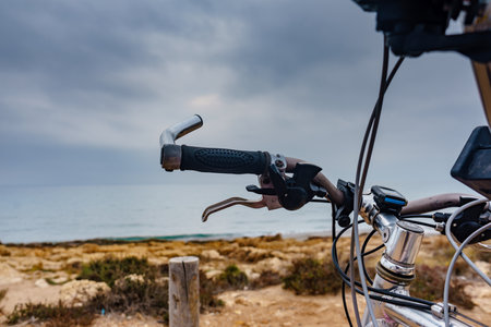 Bicycle outdoor parked on beach sea shore. Brake element. Holidays, sport and summer recreation.の写真素材