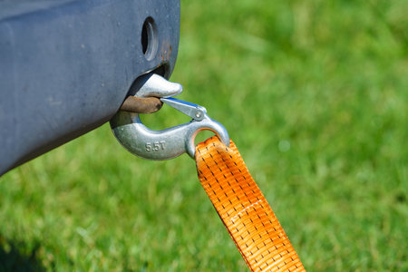 Tow hook with orange strap on car. Towing equipment. Tuggingの写真素材