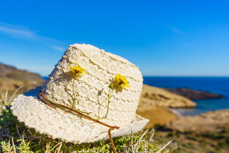 Summer hat on seacoast. Coastal spanish landscape, Calblanque Park in Murcia Spain. Hiking, activity on holidays.の写真素材