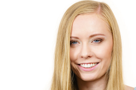 Portrait of young woman, positive female teen girl with long blond hairの写真素材