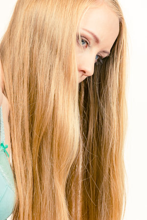 Portrait of a young woman, female with long blond hairの写真素材