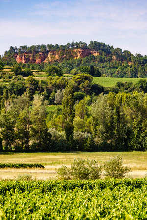 Red rocks of Colorado provencal in Roussillon, Plateau de Vaucluse, Provence in France. Summer landscape.の写真素材