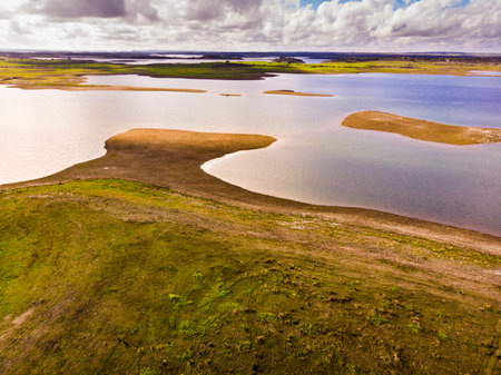 Aerial view. Nature landscape. Alqueva Dam artificial lake from village Aldeia da Luz, Alentejo tourist destination region, district of Evora, Portugal.の写真素材