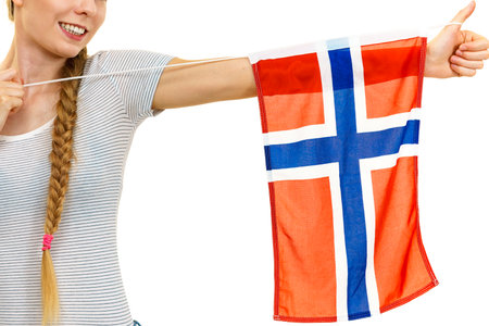 Blonde girl braid hair with norwegian flag. Scandinavian people.の写真素材