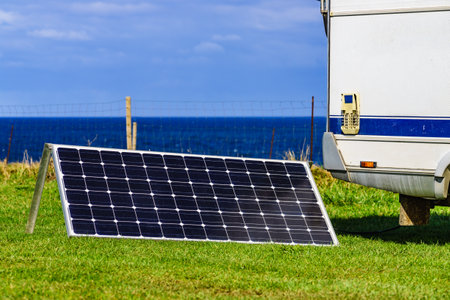 Portable solar photovoltaic panel, charging battery at camper vehicle.の写真素材