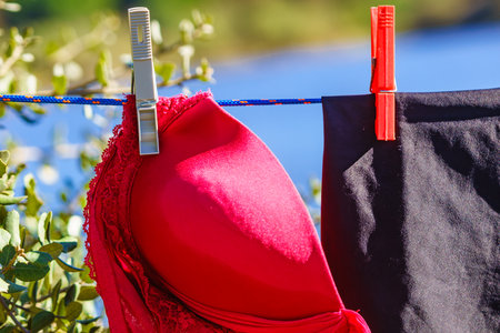 Clothes hanging to dry on laundry line outdoors. Camping on holidays tripの写真素材