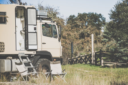 Lorry camper, house truck camping on nature. Travel with motorhome.の写真素材
