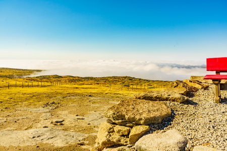 Red bench on Torre mountain peak of Serra da Estrela, the highest place in Continental Portugal.の写真素材