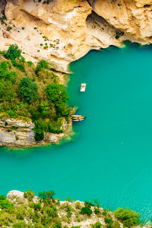 Boats on turquoise water of St Croix Lake, Verdon Gorge in french Alps mountains, Provence France. Holidays trip.の写真素材
