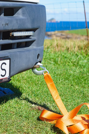 Tow hook with orange strap on car. Towing equipment. Tuggingの写真素材