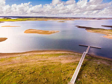 Aerial view. Nature landscape. Alqueva Dam artificial lake from village Aldeia da Luz, Alentejo tourist destination region, district of Evora, Portugal.の写真素材