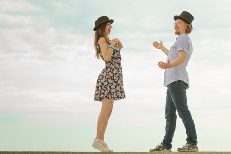 Happy couple having fun together outdoor. Happiness, great relationship. Man and woman fooling...