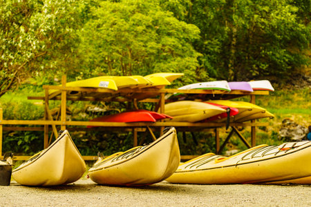 Kayaks on water shore. Rental center. Travel, holidays and active lifestyle.の写真素材