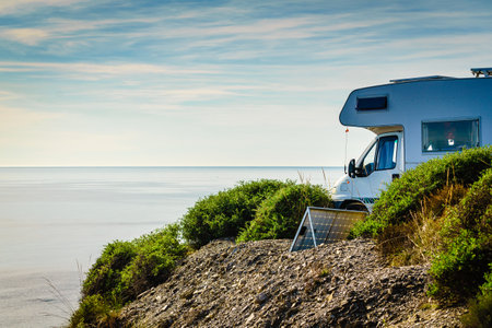 Camper rv camping on sea shore. Caravan vacation.の写真素材