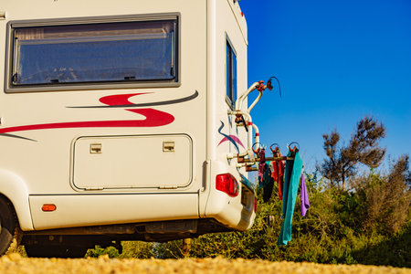 Caravan vehicle with clothes hanging to dry. Vacation with motor home. Wild camping on nature.の写真素材