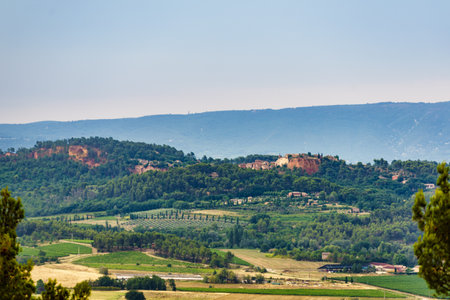 Red rocks of Colorado provencal in Roussillon, Plateau de Vaucluse, Provence in France. View from...