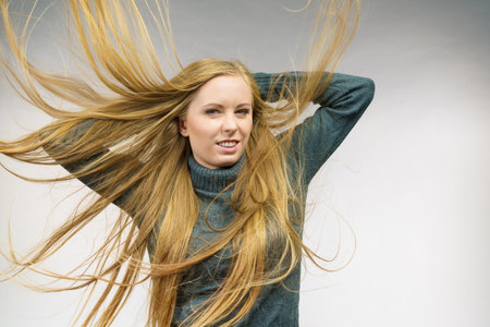 Young female with long messy hair. Haircare concept.