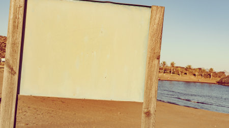 Tourism holidays and travel. Empty board on beach in Spainの写真素材