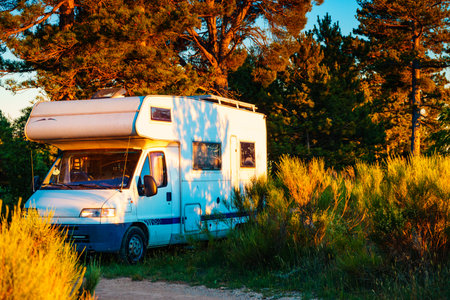 Caravan rv wild camping on nature. Adventure with camper vehicle.