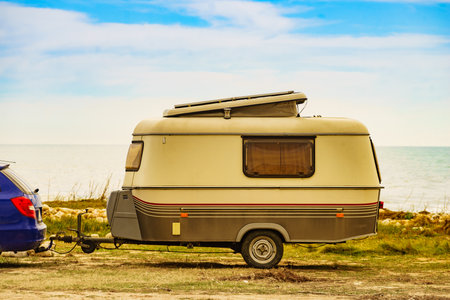 Caravan trailer camping on seashore. Capicorb, Valencia region Spain. Vacation with mobile home.の写真素材