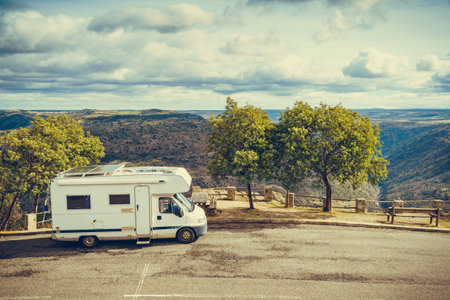 Caravan camping in mountains at Penedo Durao viewpoint, north Portugal. Adventure, travel with motorhome, lifestyle.の写真素材
